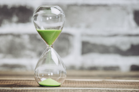 Brick background and hourglassの写真素材