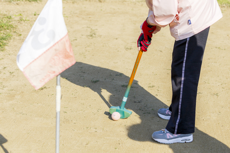 Asian elderly play ground golfの写真素材