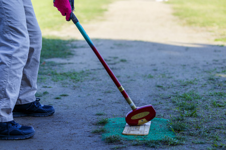 Asian elderly play ground golfの写真素材