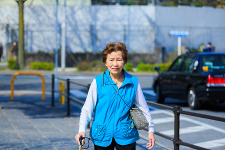 Asian elderly going outの写真素材