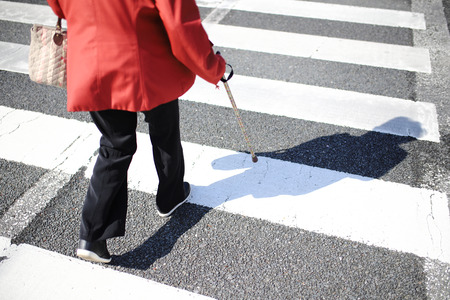 Senior woman crossingの写真素材