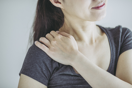 Asian woman and stiff shouldersの写真素材