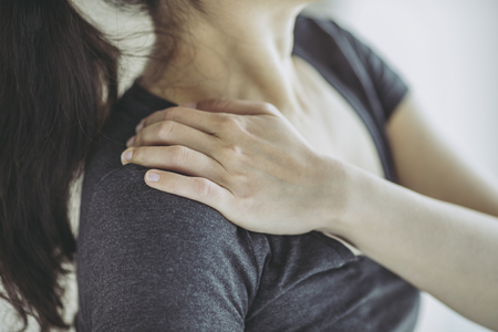 Asian woman and stiff shouldersの写真素材