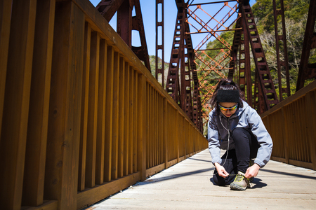Fitness woman on bridgeの写真素材