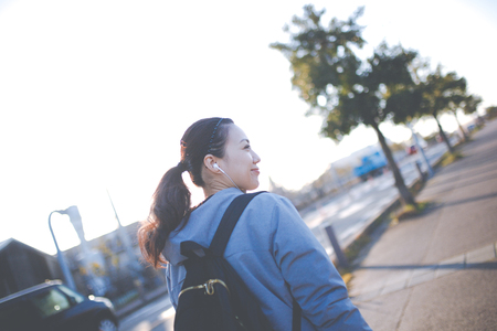 Sunset and Earphone and womenの写真素材