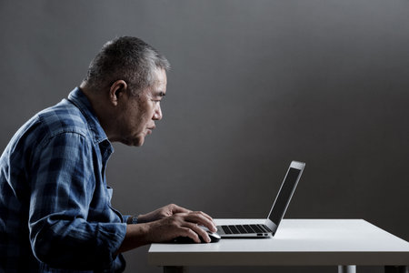 Laptops and Asian senior men