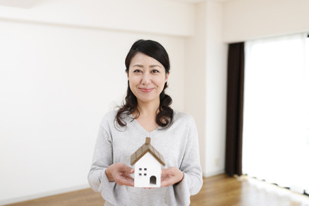 woman glad in an empty roomの写真素材