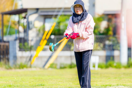 Asian elderly play ground golf