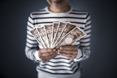 Housewife with moneyの写真素材
