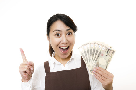 Housewife with moneyの写真素材