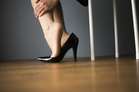 Black high heels and womenの写真素材