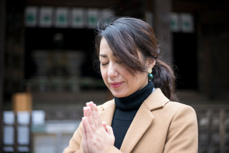 A woman worshiping at a shrine