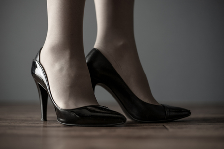 Black high heels and womenの写真素材