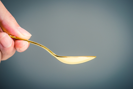 Gold and spoonの写真素材