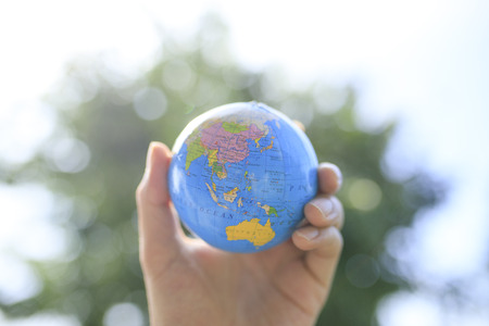 The globe and human handの写真素材
