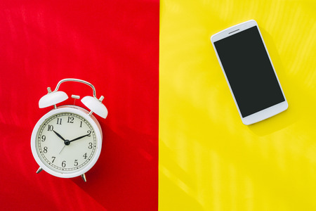 Alarm clock and smartphoneの写真素材