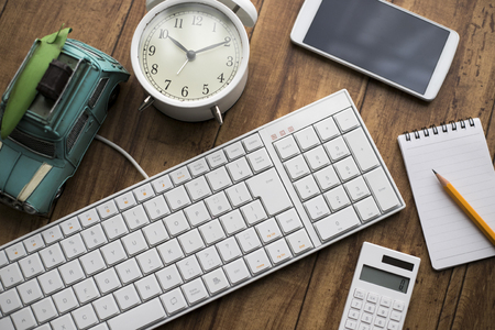 Keyboard and smartphone and clockの写真素材