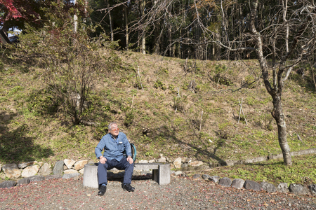 Elderly men sitting on the benchの写真素材