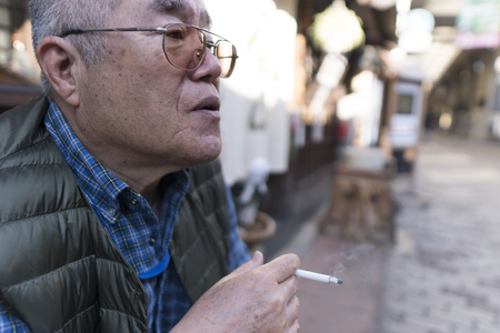 Smoking and male seniorの写真素材