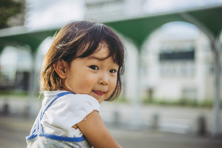 A small girl and a portraitの写真素材