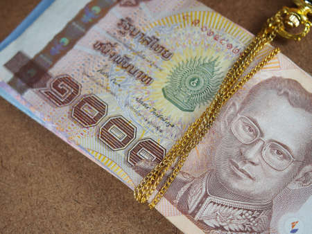 Binding Gold Necklace with Thai Banknotes Moneyの写真素材