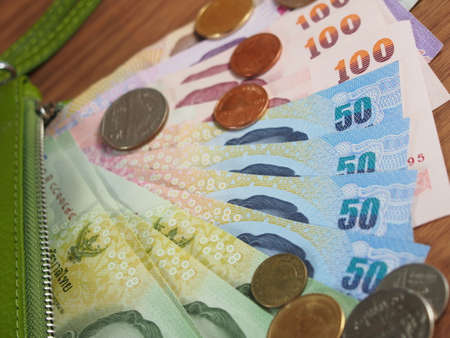 Thai Baht Money with green purse of rim, Banknotes and Coinsの写真素材