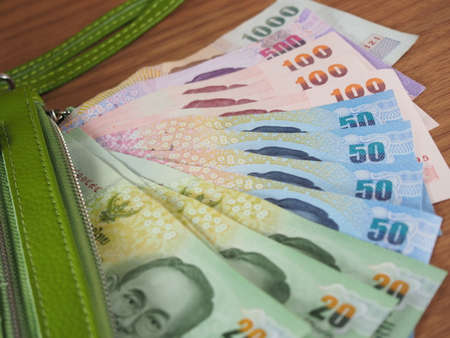 Thai Baht Money with green purse of rim, Banknotesの写真素材