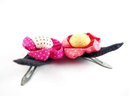 A couple of black hair clip, handmade flowers, made from colorful fabric, sunflower shape, modern hair accessory, isolated on white backgroundの写真素材