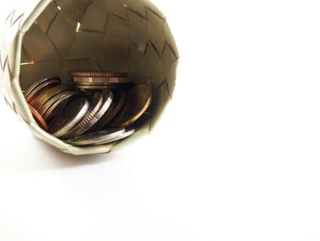 Save and make money, coins, thai money in basket from natural materialfingerprintingの写真素材