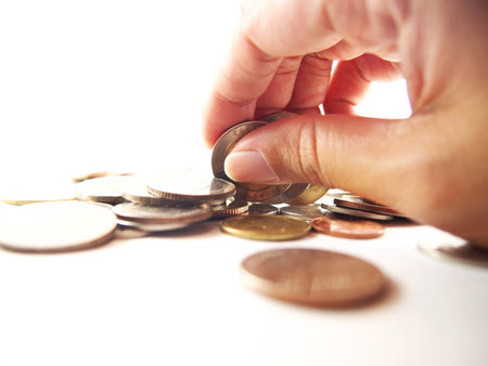Take coins by hand, economy expenseの写真素材