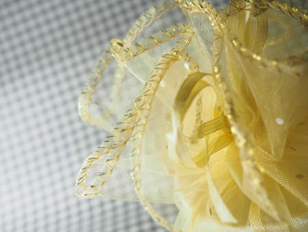 Yellow netted fabric, wrapped as cute bouquetの写真素材