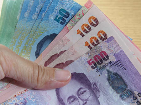 Financial business, bank bills in hand, save and earn moneyの写真素材