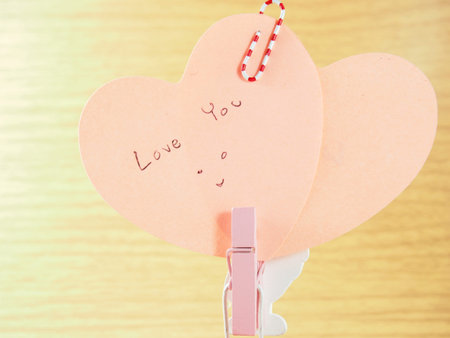 Sticky paper notes on pink wooden clip paper, Valentines day festival