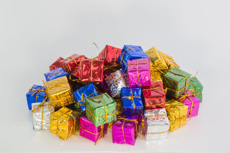 A lot of christmas parcels on a heap with a white backgroundの写真素材