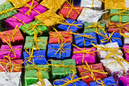 A lot of christmas parcels flat on the floor in different colorsの写真素材
