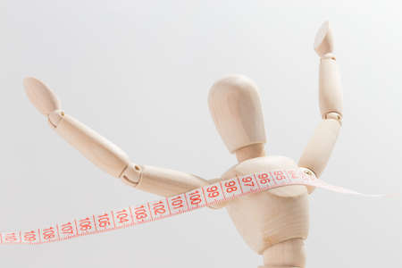 Wooden puppet arriving at the destination of weight lossの写真素材