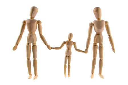 Family of wooden puppets with the kid looking at his motherの写真素材
