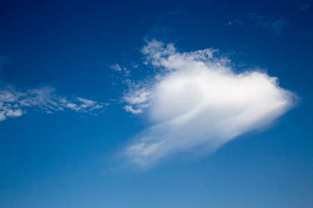Blue sky with arrow cloud on a sunny dayの写真素材