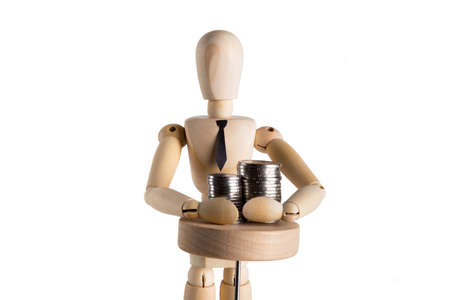 Businessman puppet grabbing money in front of white backgroundの写真素材