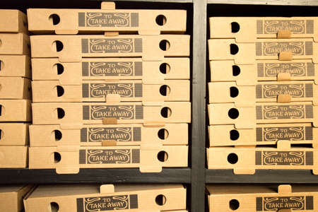 Pile of empty pizza take away boxesの写真素材