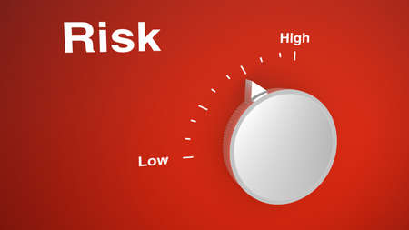 Risk control knob on red with a scale from low to highの写真素材