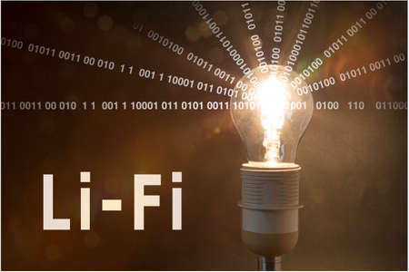 Glowing bulb is emitting datastreams of one and zeroの写真素材