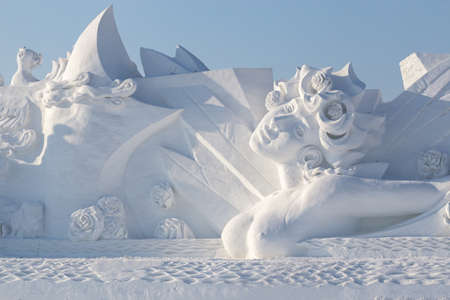 Harbin,China  20 January 2016: Beautiful woman snow sculpture in front of blue skyのeditorial素材
