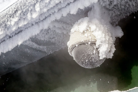 Frozen security camera with snow and ice