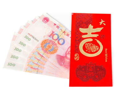 Red chinese envelope called hong bao to exchange money with the words a lot of luck and fortune written in chinese and five hundred chinese yuanの写真素材