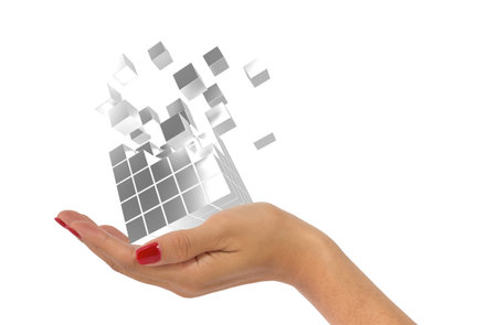 Woman's hand holding silver cubes emitting small cubes as bid data concept