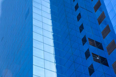 Shanghai,China - 02 10 2016: Impressive blue office building front with reflections on a clear sunny day without pollution in Shanghai Chinaのeditorial素材