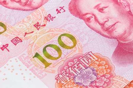 Closeup of the new 100 RMB bill with focus on the yellow green 100 numberの写真素材