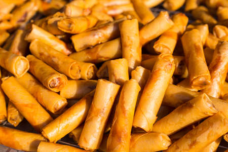 Pile of fried Malaysian spring roles on a local market in Malaysiaの写真素材