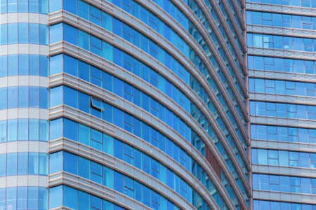 Front of an office building rounded with blue windowsのeditorial素材